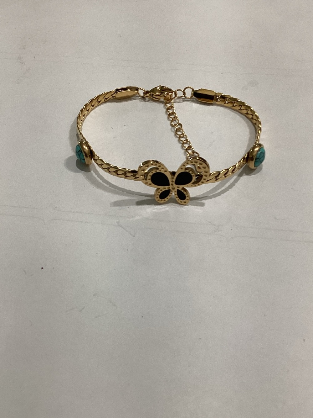 Gold Butterfly Bracelet with Black and Turquoise Accents
